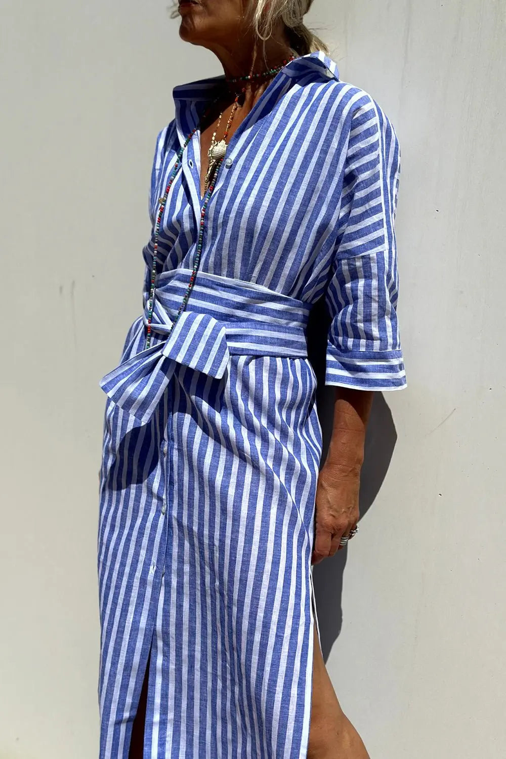 Stylish women's striped button-down midi dress. A collared shirt dress perfect for summer & warm weather comfort.