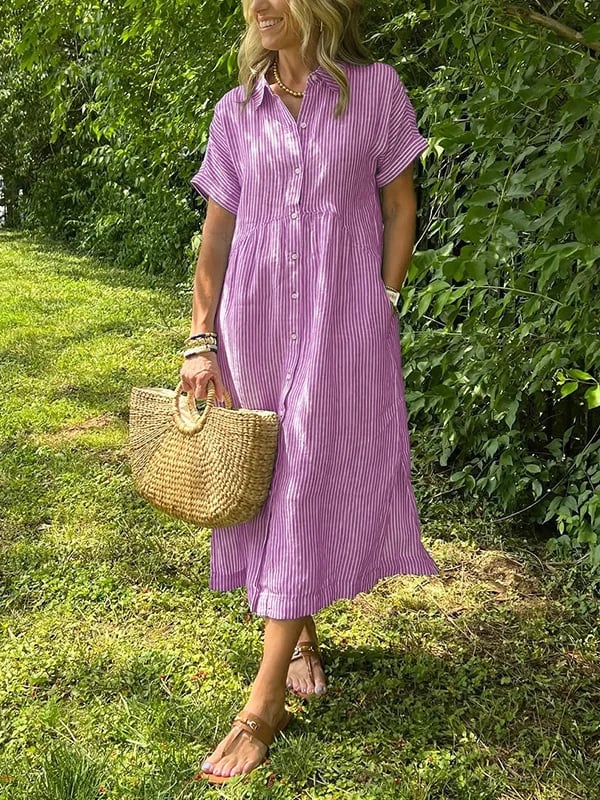 Elegant women's striped midi dress with a full button front, offering a relaxed yet fashionable summer look.