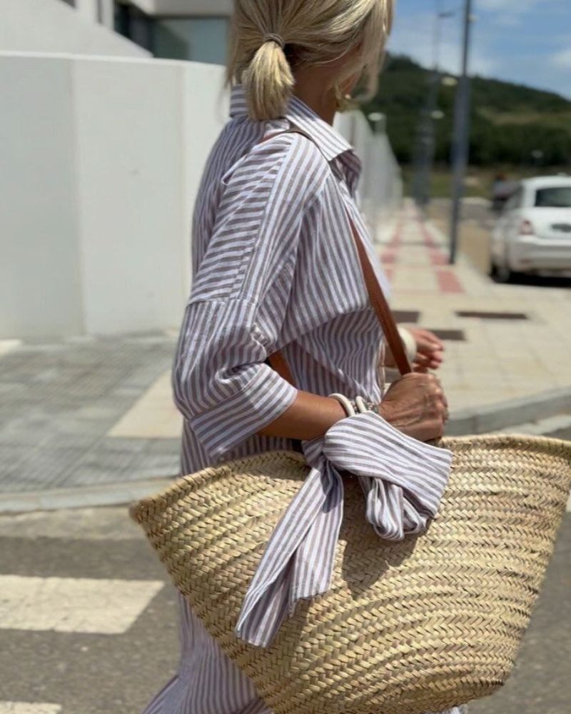 Stylish women's striped button-front midi dress, a flattering shirt dress design for trendy spring/summer looks.