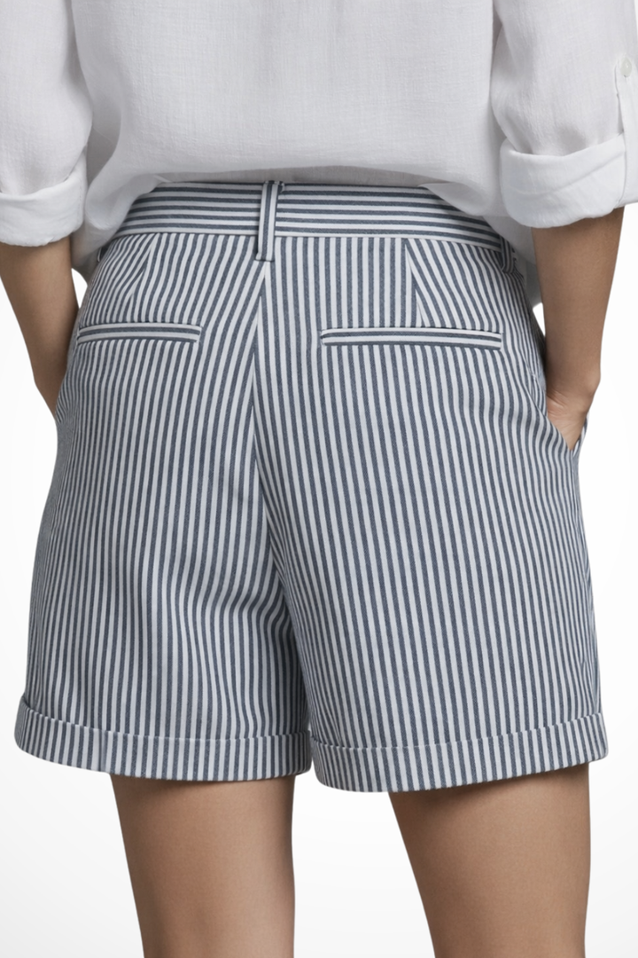 Vertical striped pattern on women's high waist tailored shorts, elongating the silhouette for a chic summer.