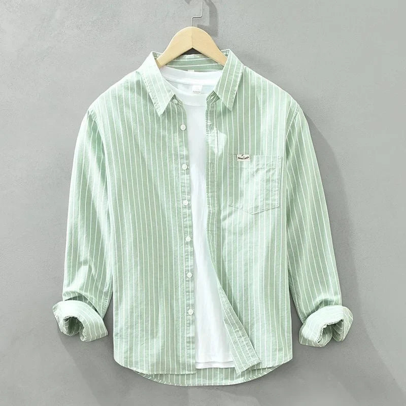 Versatile women's striped long-sleeve button-up shirt for spring, summer, or office casual wear. Relaxed fit.