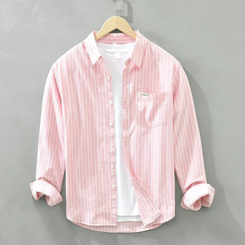 Stylish women's striped long-sleeve button-up shirt with practical chest pocket. Great for women's everyday wear.