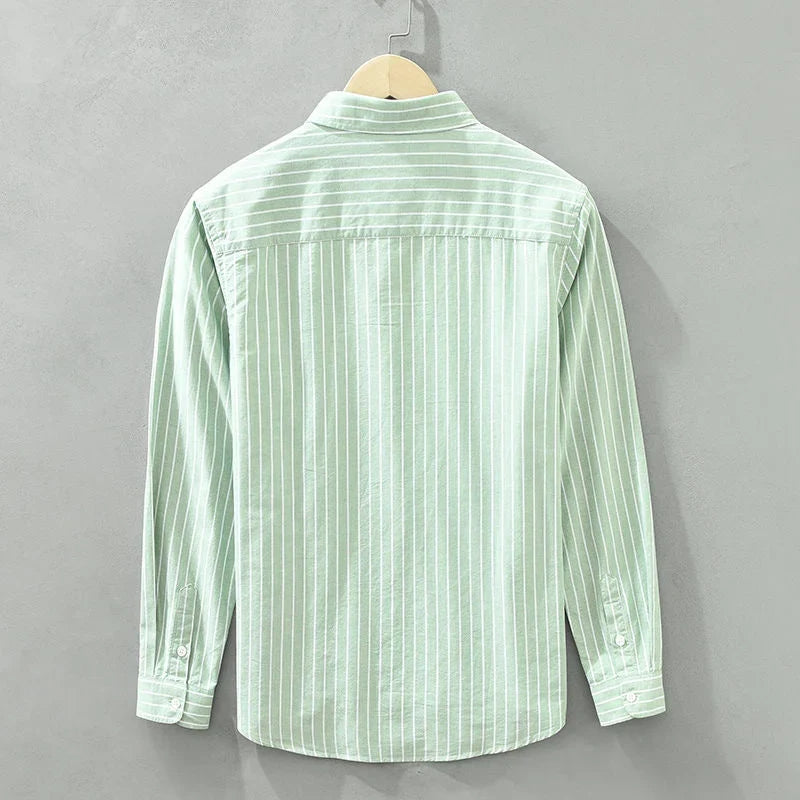 Trendy women's striped long-sleeve button-up. A versatile casual top for women's spring and summer fashion.