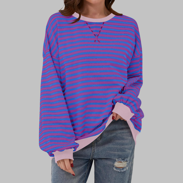 Soft women's striped long sleeve sweatshirt, relaxed fit, designed for comfortable everyday style.