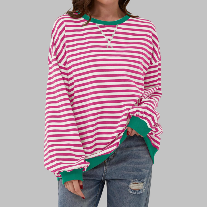 Comfortable women's striped long sleeve top, relaxed fit, ideal for casual wear in fall/winter.