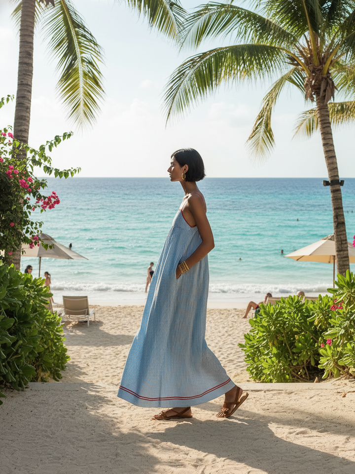 Elegant striped maxi dress for women, featuring delicate spaghetti straps & stylish gathered waist.