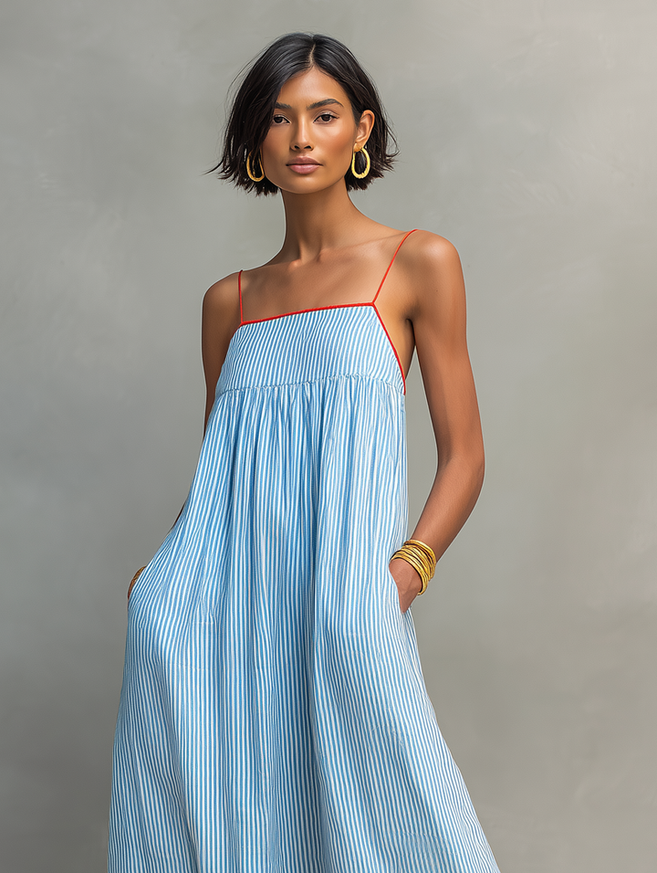 Striped women's maxi dress with spaghetti straps, a flattering gathered waist, perfect for warm weather.