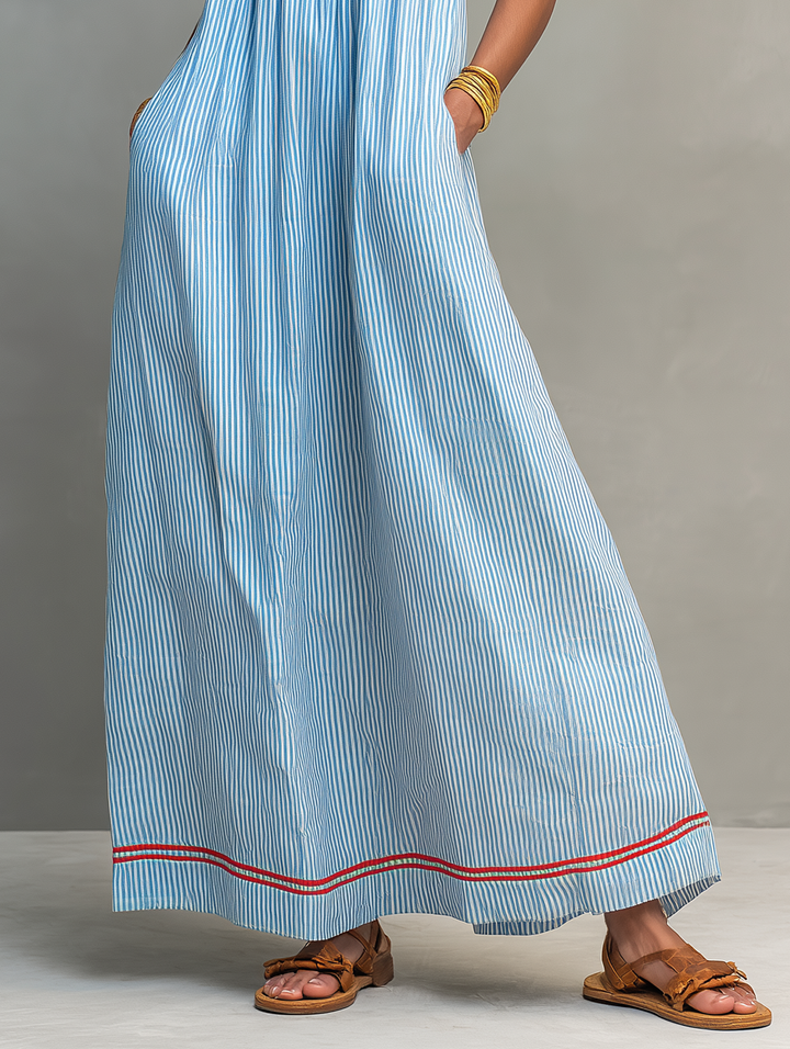Flowy striped maxi dress for women, designed with spaghetti straps and a chic gathered waist.