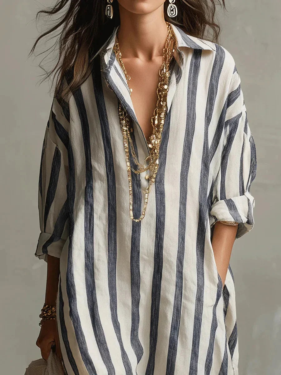 Elegant women's striped maxi shirt dress, featuring a classic design and functional roll-tab long sleeves.