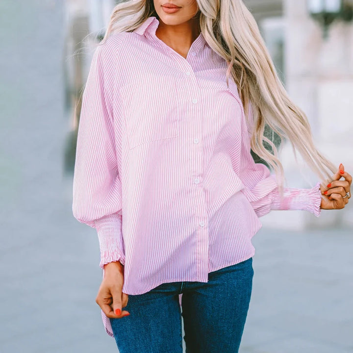 Casual women's striped oversized shirt featuring a button-down front and trendy balloon sleeves.