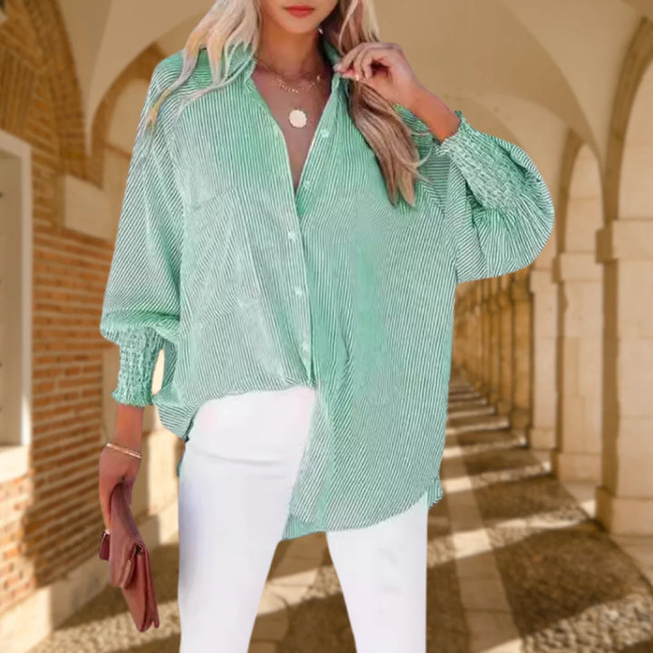 Relaxed fit women's striped shirt, oversized button-down style with fashionable shirred balloon sleeves.