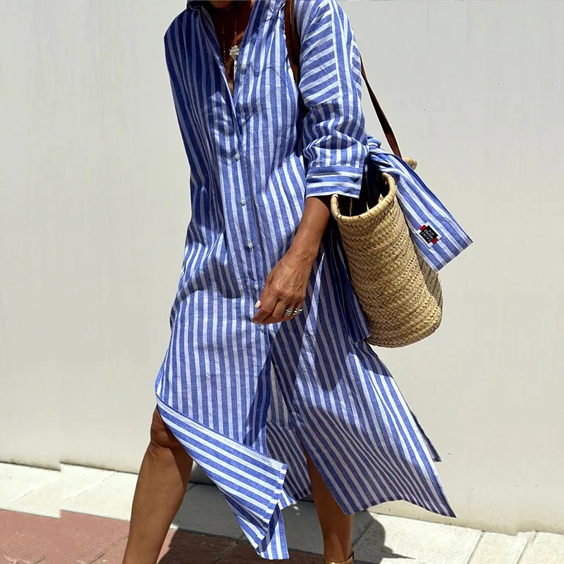Model wearing a chic women's relaxed fit striped shirt dress, great for summer vacation.