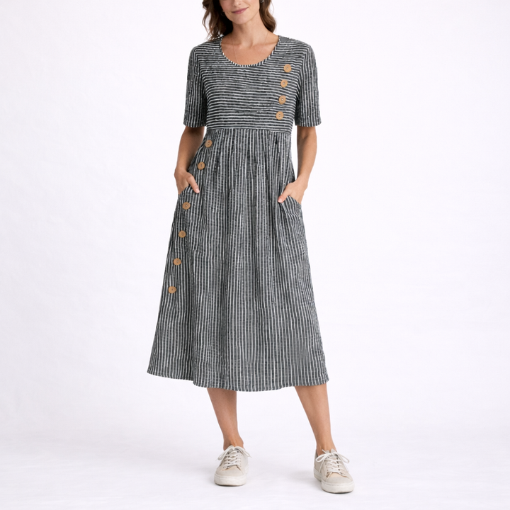 Casual summer striped midi dress for women, featuring a scoop neck, short sleeves, and useful pockets.