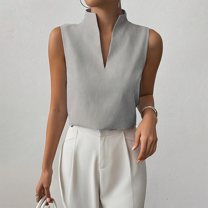 Fashionable women's sleeveless top, striped design & stand collar, great for elegant summer business casual.
