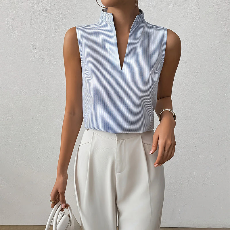 Chic women's sleeveless stand collar top, featuring a timeless striped pattern, ideal for office or summer.