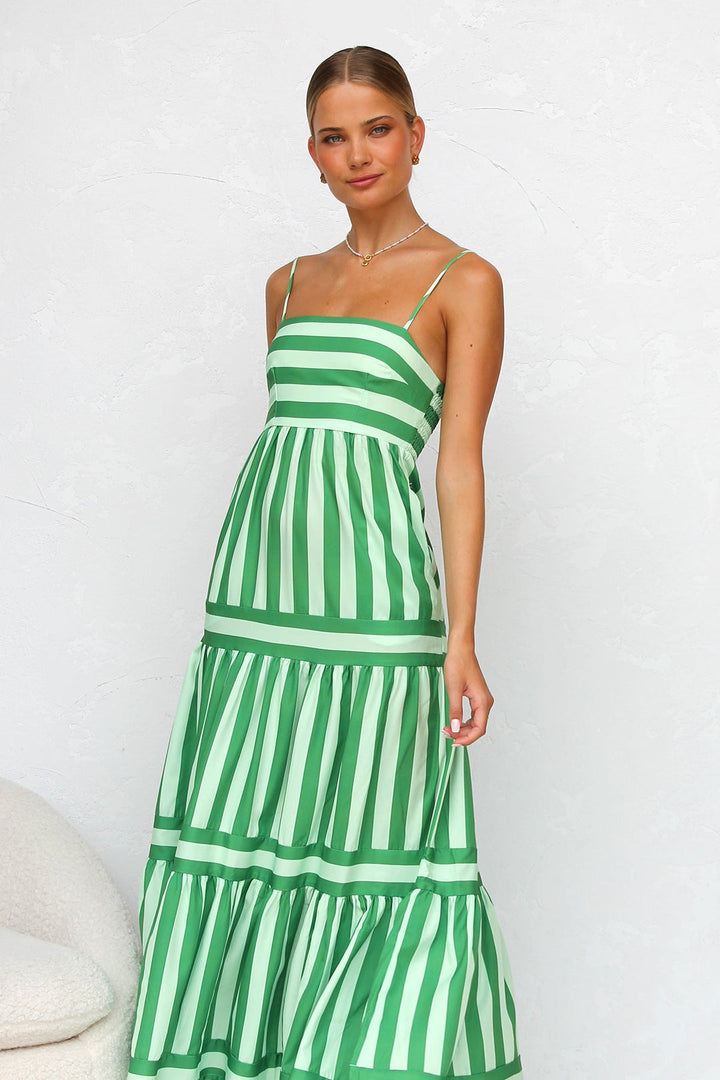 Striped tiered maxi dress, a stylish women's summer dress or vacation outfit with spaghetti straps.