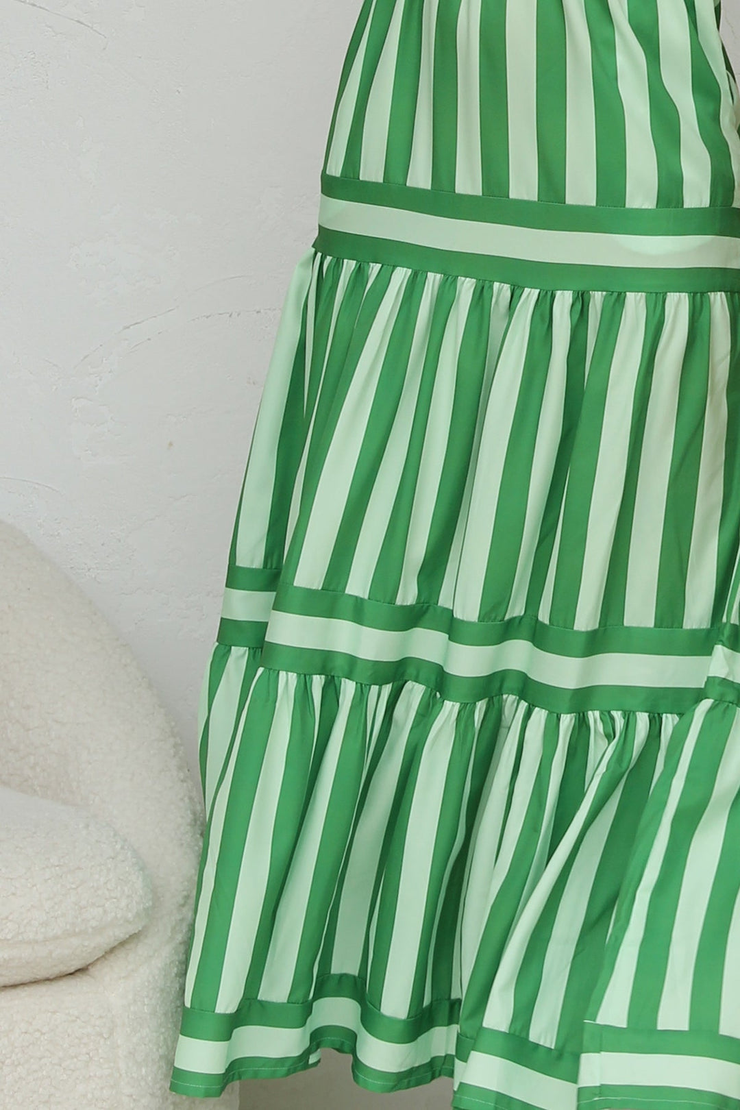 Green striped tiered maxi dress for women, a breezy summer dress ideal for vacation style.