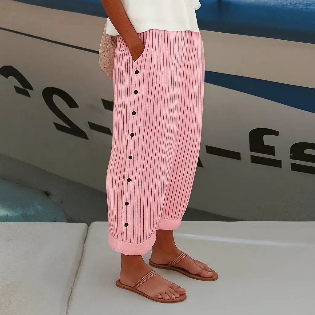 Stylish women's striped pants with elastic waist & button detail. Relaxed fit, perfect for casual chic fashion.
