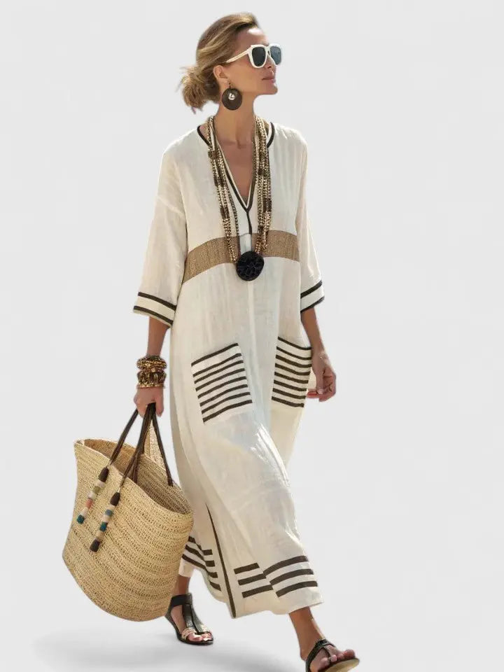 Elegant women's striped V-neck maxi dress, ideal for resort wear, beach, or vacation. Flowing kaftan style.