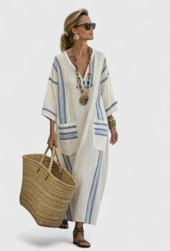Bohemian women's striped maxi kaftan dress with V-neck. Flowing summer style for beach or casual outings.