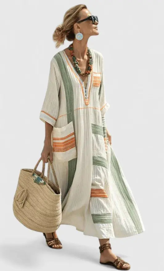 Women's striped V-neck maxi kaftan dress. Comfortable, relaxed, and flowing fit. Perfect for summer vacations.