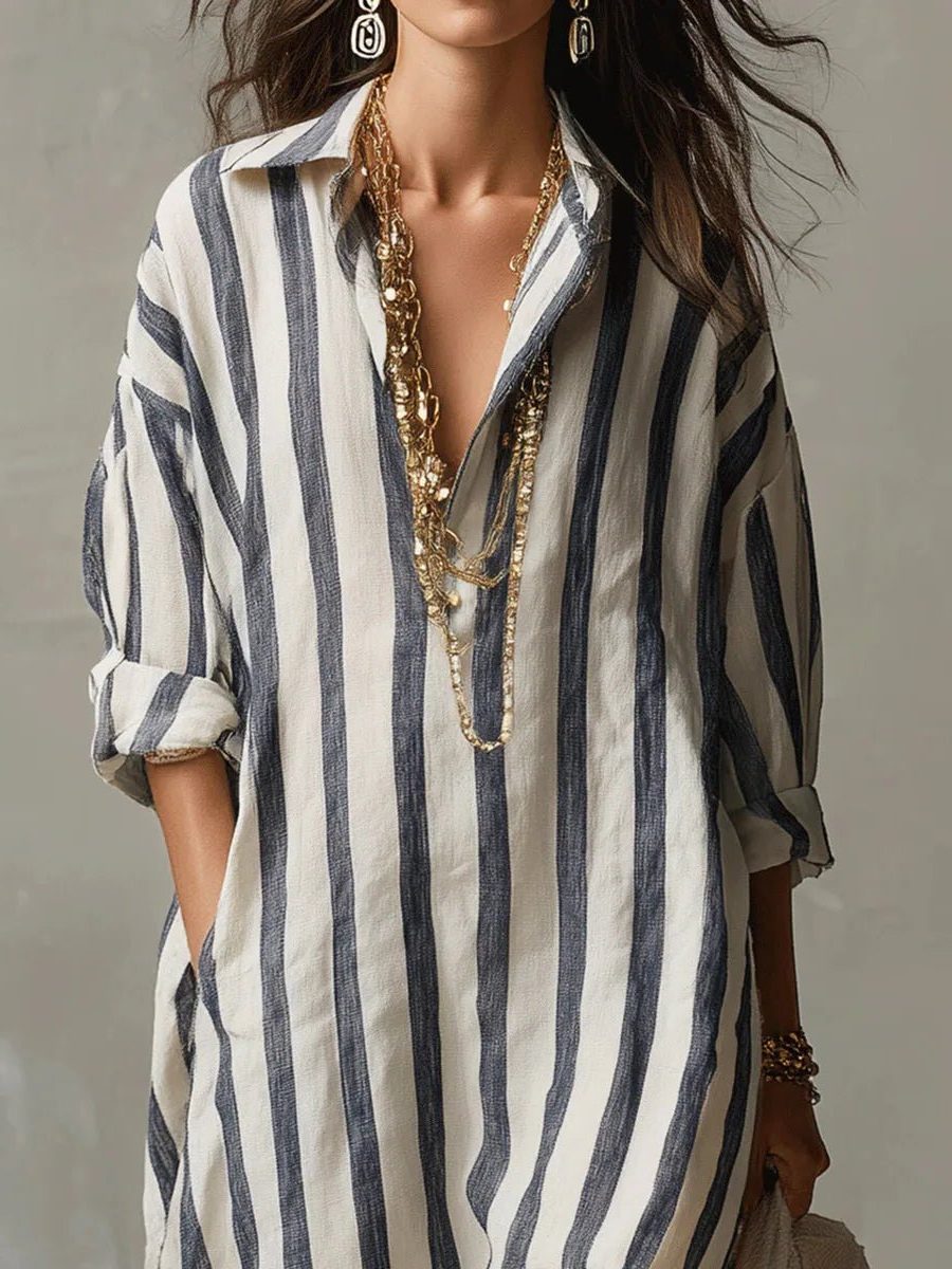 Front view of a women's casual striped V-neck maxi shirt dress with long sleeves for beach outings.