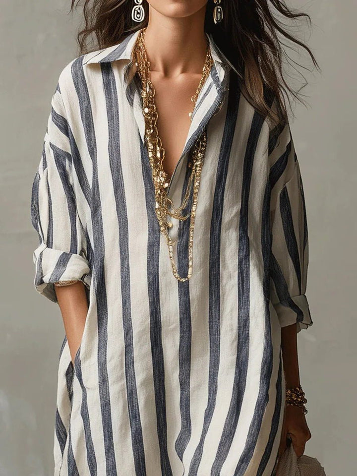 Front view of a women's casual striped V-neck maxi shirt dress with long sleeves for beach outings.