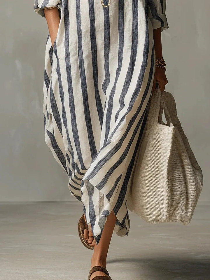 Close-up of the striped fabric and V-neck on a women's long sleeve maxi shirt dress, showcasing detail.