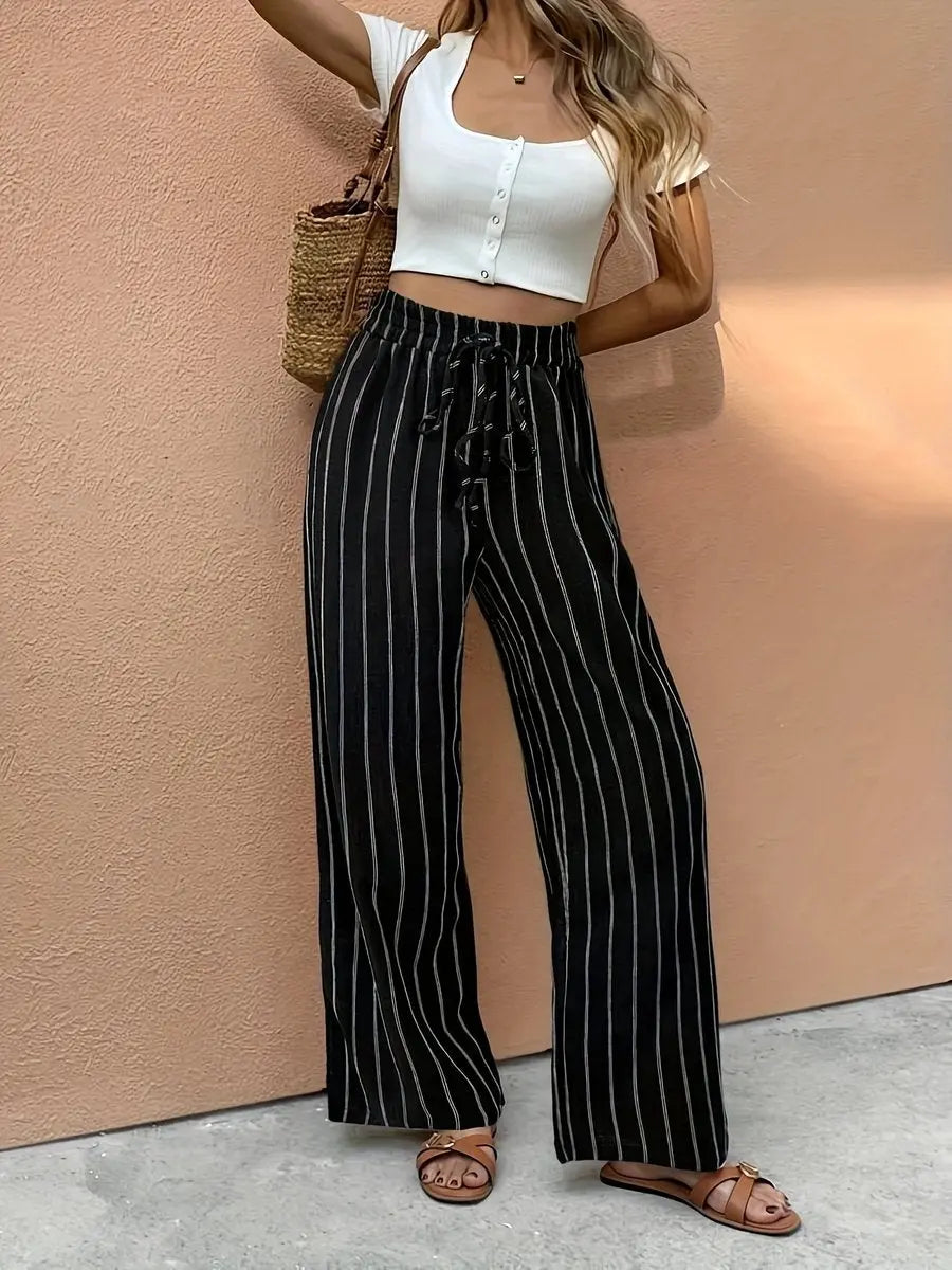 Chic women's pinstripe wide leg linen pants, offering effortless comfort & relaxed fit for warm weather fashion.