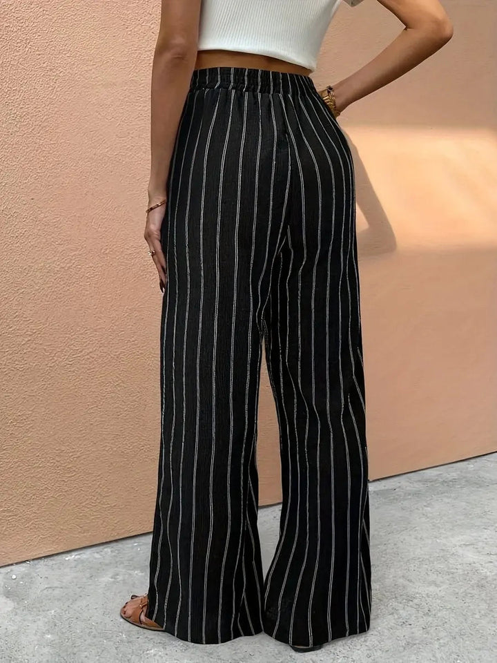 Comfortable women's striped wide leg linen trousers with elastic drawstring waist for effortless casual chic.