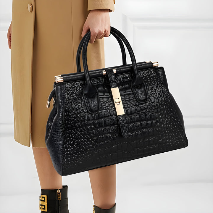 Sophisticated ladies' leather handbag, structured with a chic alligator embossed design. Perfect for office.