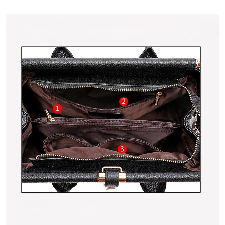 Elegant women's structured leather handbag, alligator embossed, multiple compartments. A versatile fashion accessory.