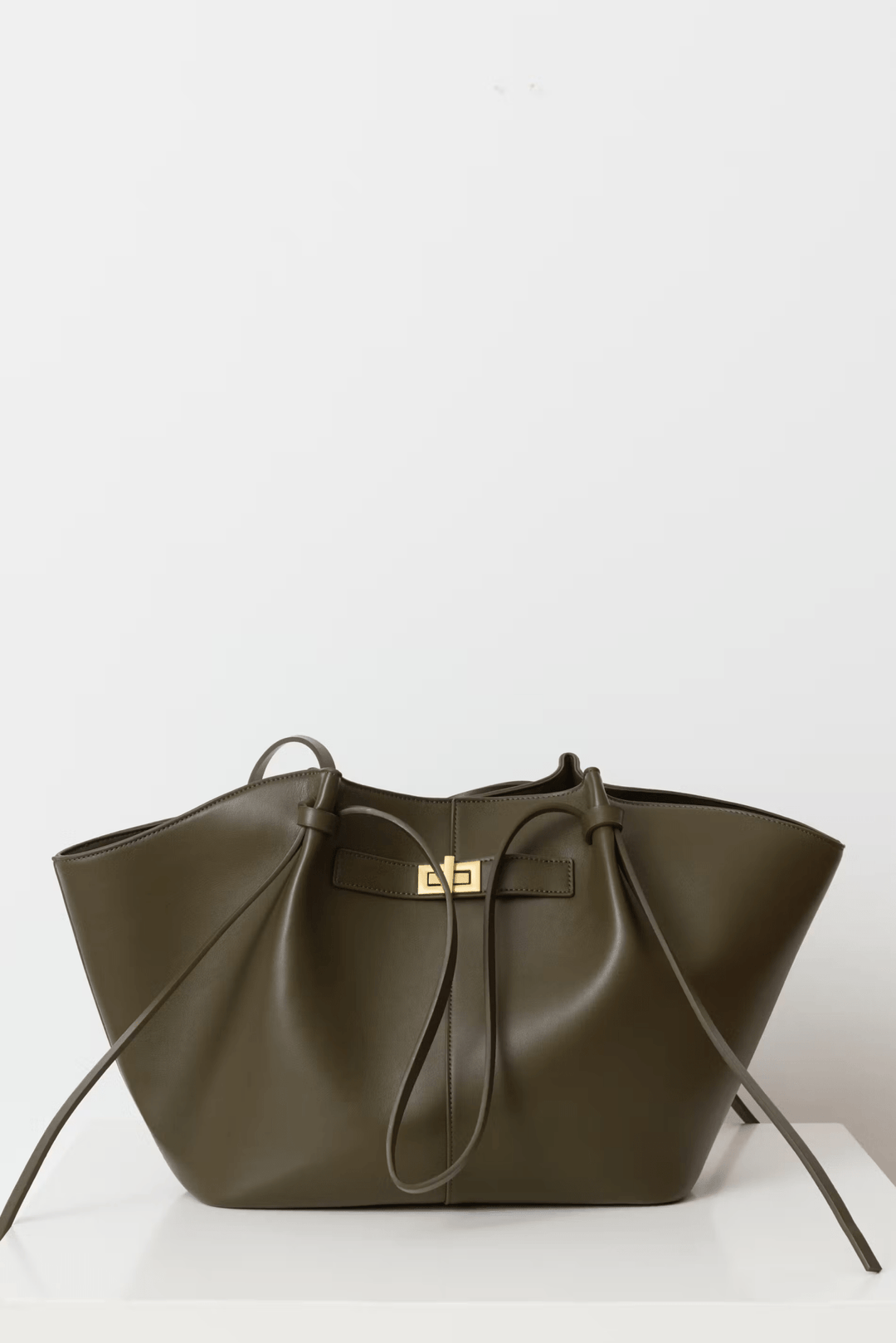 Women's large capacity structured shoulder bag with elegant gold hardware, a timeless fashion accessory.