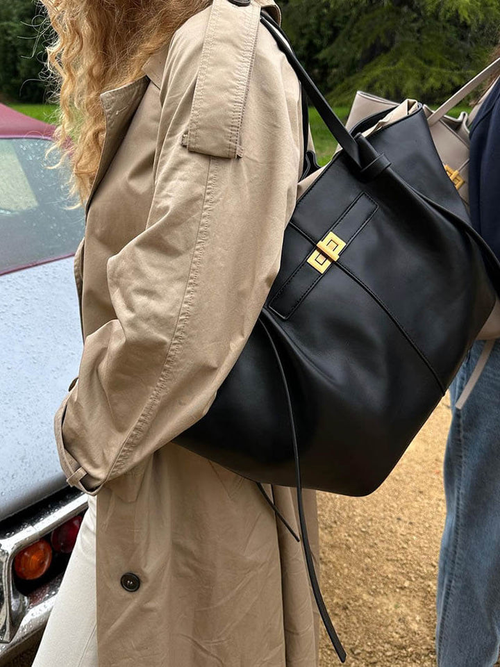 Minimalist structured women's shoulder bag with sophisticated gold accents, large capacity tote.