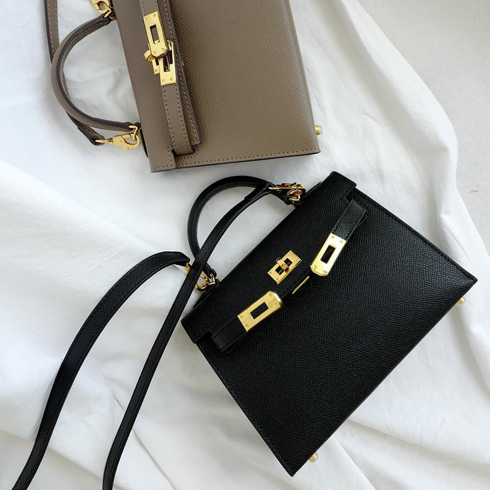 Elevated everyday women's bag: structured, convenient top handle, and a luxurious gold lock detail.