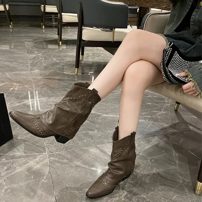 Women's studded western mid-calf boots, pointed toe, sturdy block heel. Edgy fashion footwear.