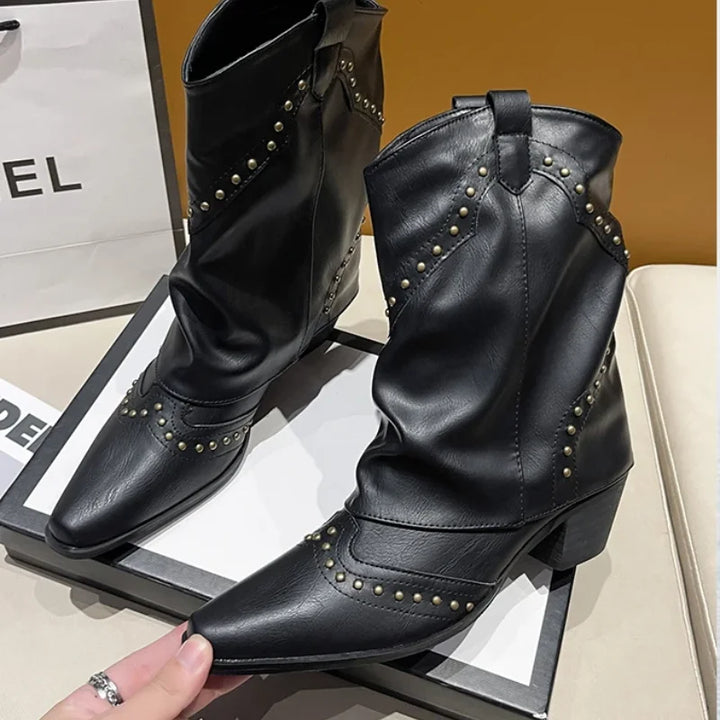 Brown women's mid-calf boots with stud embellishments, block heel, and elegant pointed toe.