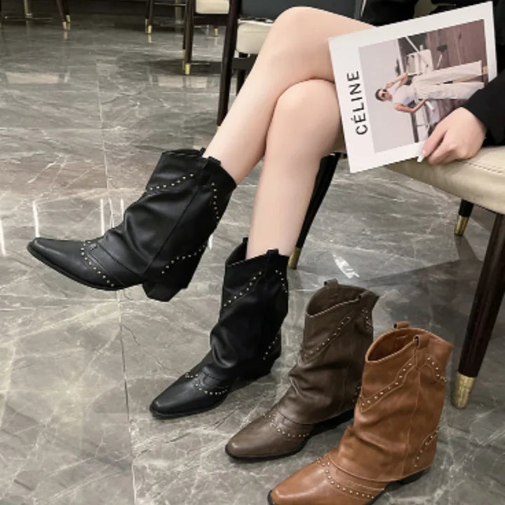 Women's pointed toe western boots, studded details, mid-calf design for a fashionable statement.