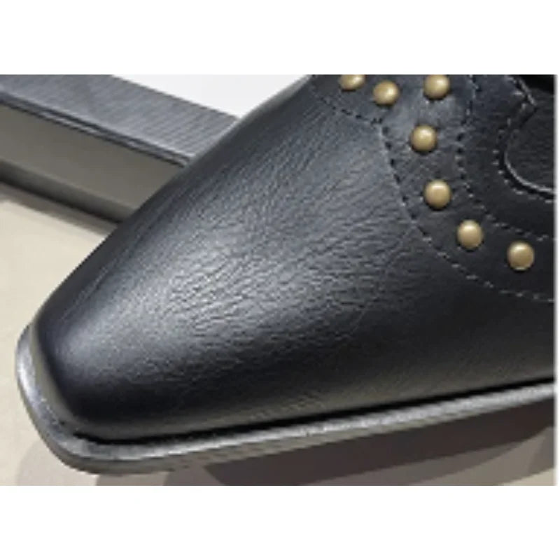 Elegant women's studded boots, western inspired, with a practical block heel and sharp pointed toe.