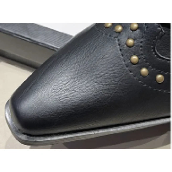 Elegant women's studded boots, western inspired, with a practical block heel and sharp pointed toe.