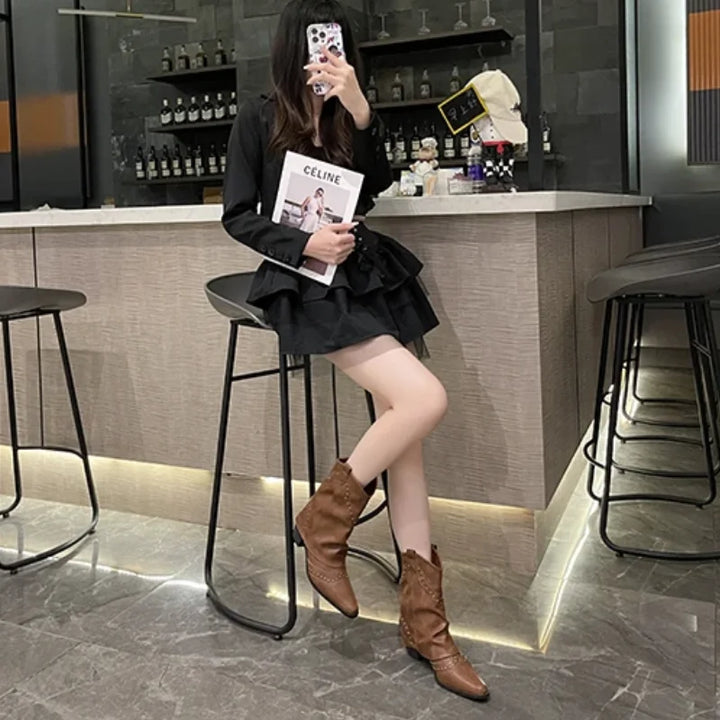 Edgy women's mid-calf boots, studded design, western aesthetic, perfect for a bold fashion choice.