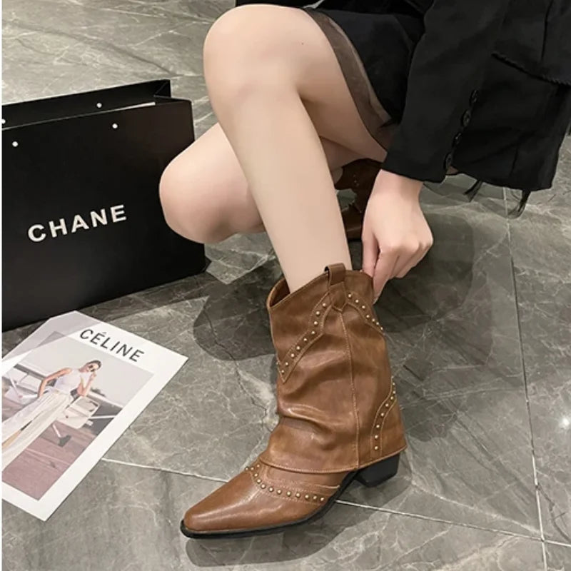 Fashionable women's boots, pointed toe, studded, western style, and a supportive block heel.