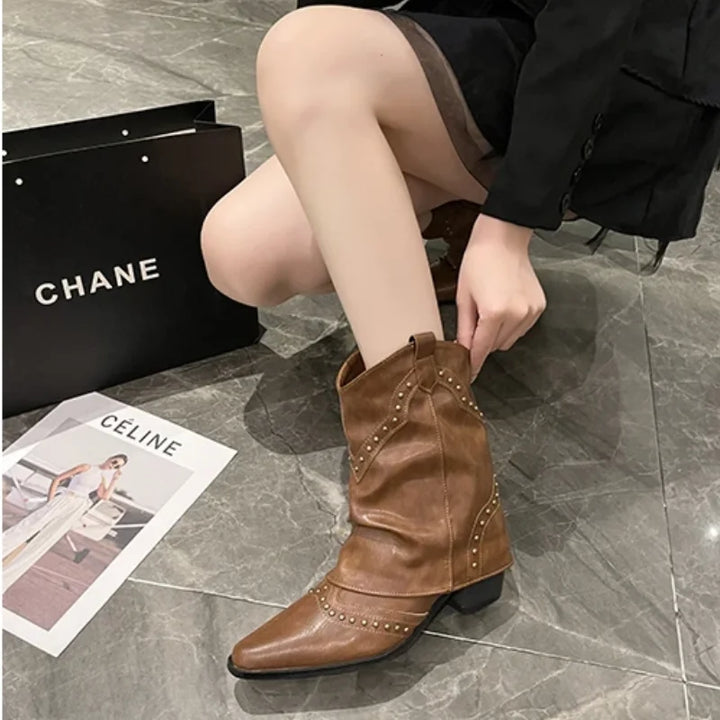 Fashionable women's boots, pointed toe, studded, western style, and a supportive block heel.