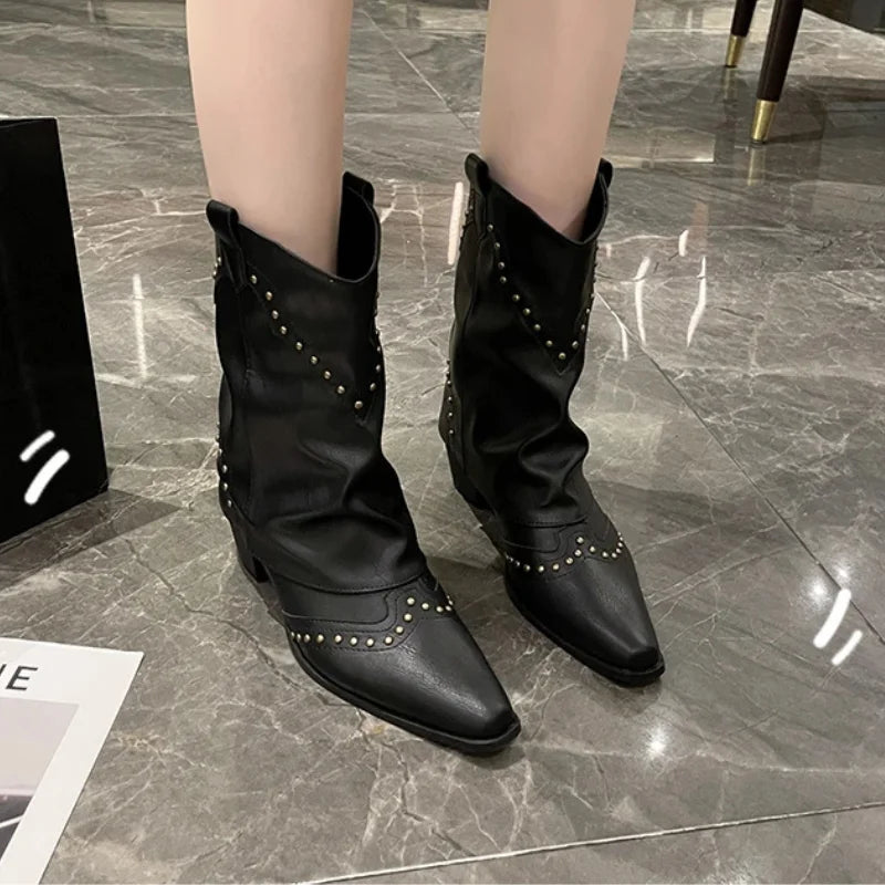 Women's pointed toe boots, mid-calf height, western style with striking studded embellishments.