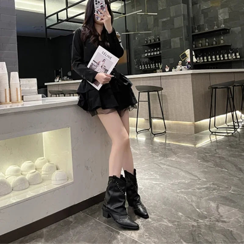 Chic women's western boots, studded accents, pointed toe for an edgy and fashionable look.