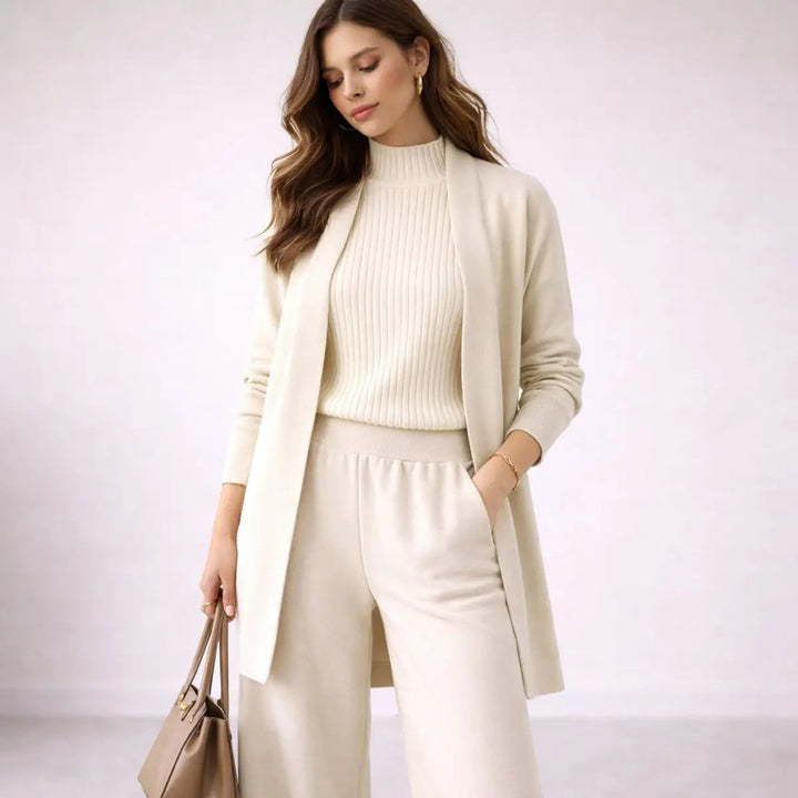 Women's stylish 3-piece lounge set with relaxed fit cardigan, cami, and wide-leg trousers. Comfortable co-ord.
