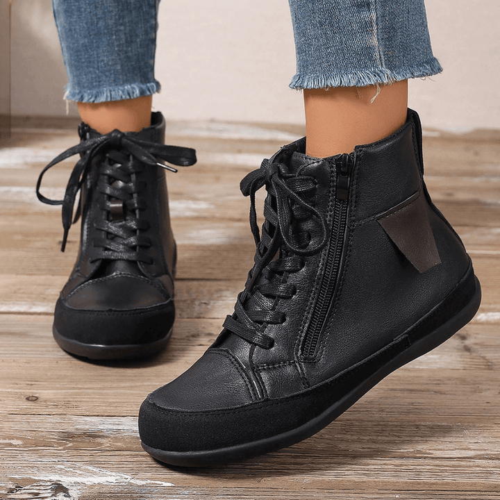 Comfortable black women's ankle boots with side zipper, versatile for fashion-forward fall & winter wear.