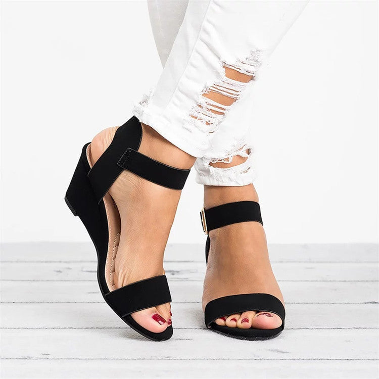 Women's stylish ankle-strap wedge sandals, perfect for summer fashion. Comfortable open-toe platform design.