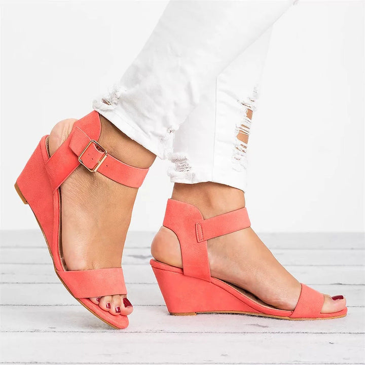 Stylish women's open-toe platform wedge sandals with secure ankle strap for elegant summer casual wear.