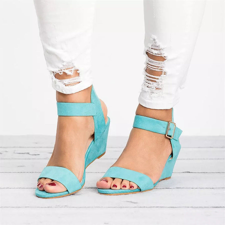 Chic women's ankle-strap wedge sandals, comfortable for spring & summer. Elegant open-toe platform design.